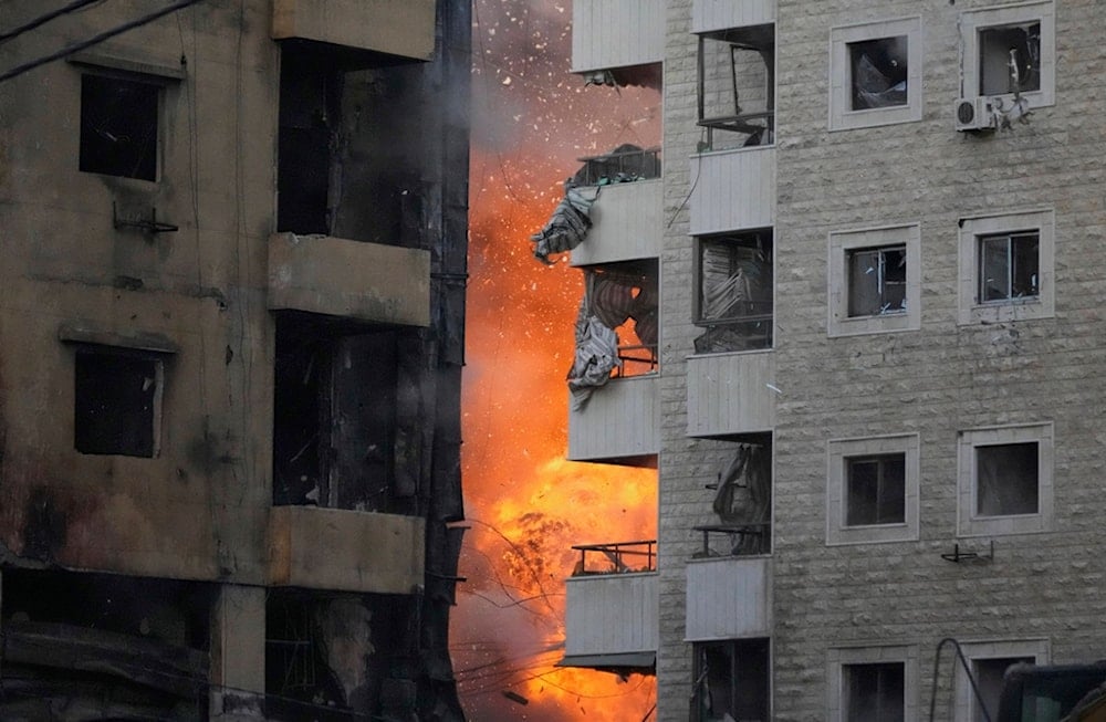 Flames rise between two buildings after an Israeli airstrike on Dahiyeh in the southern suburb of Beirut, Lebanon, Sunday, April 27, 2025 (AP)
