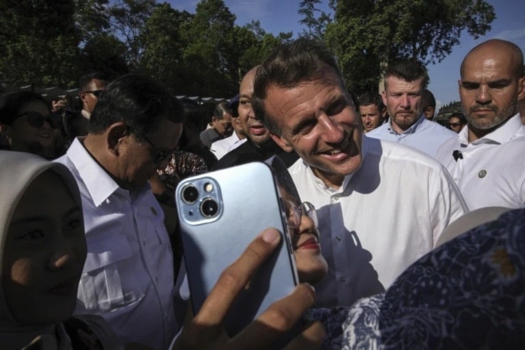 France's President Emmanuel Macron poses for a during a visit at Borobudur Temple, in Magelang, Central Java, May 29, 2025 (Yasuyoshi Chiba/AP)
