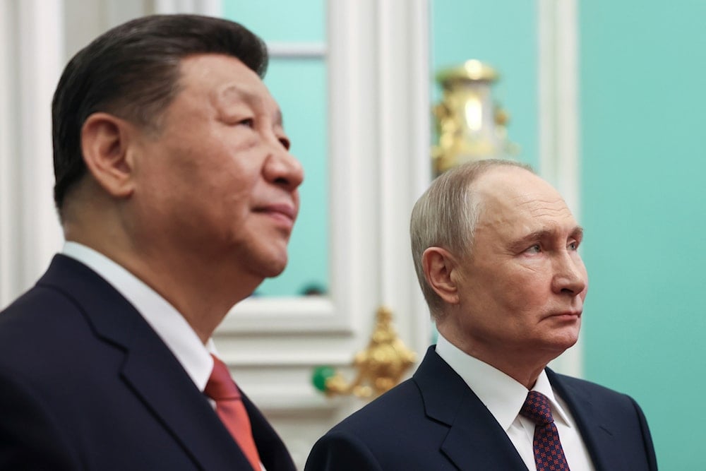 China President Xi Jinping, left, and Russian President Vladimir Putin walk inside the Kremlin's Grand Palace at the Kremlin in Moscow, Russia, Thursday, May 8, 2025 (AP)