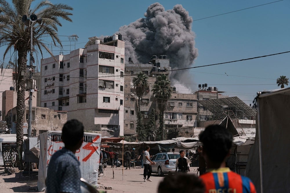 Smoke rises in the sky following an Israeli airstrike in Gaza City, Friday, May 30, 2025 (AP)