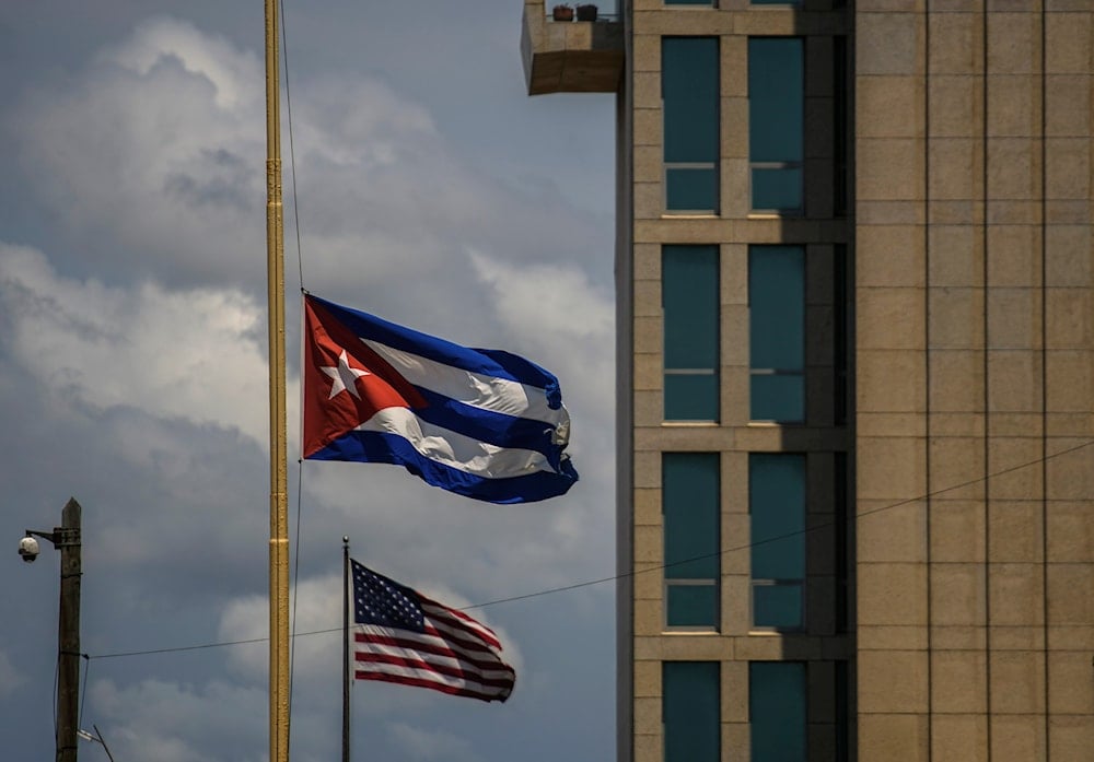 A Cuban flag is seen next to an American flag outside the U.S. embassy in Havana, Cuba, May 17, 2022. (AP)