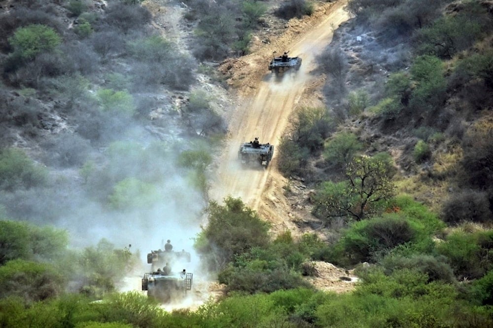 In this photo released by the Inter Services Public Relations, Army tanks roll down during military exercises in Tilla Field Firing Range in the Jhelum district, Pakistan, Thursday, May 1, 2025 (AP)
