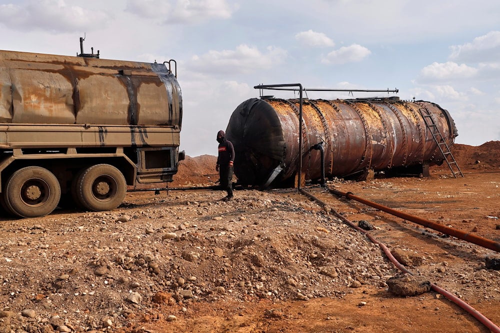 A worker operates a makeshift refinery on the outskirts of Qamishli, northeast Syria, on March 22, 2025