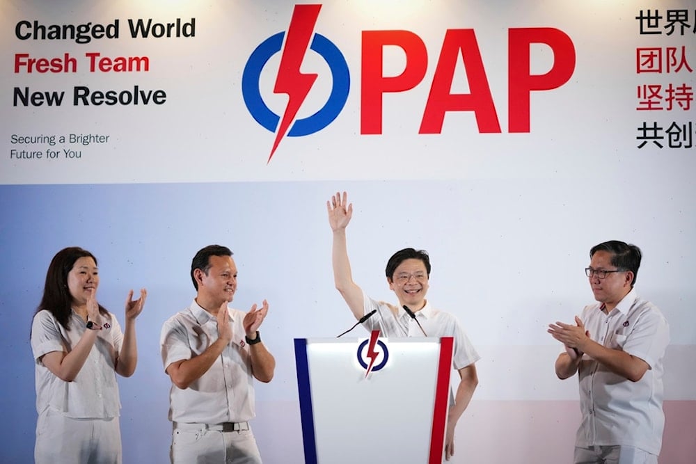 Prime Minister Lawrence Wong's, from People's Action Party (PAP) thanks his supporters and voters at an assembly area for People's Action Party supporters, on the day of the general election in Singapore, Saturday, May 3, 2025 (AP)