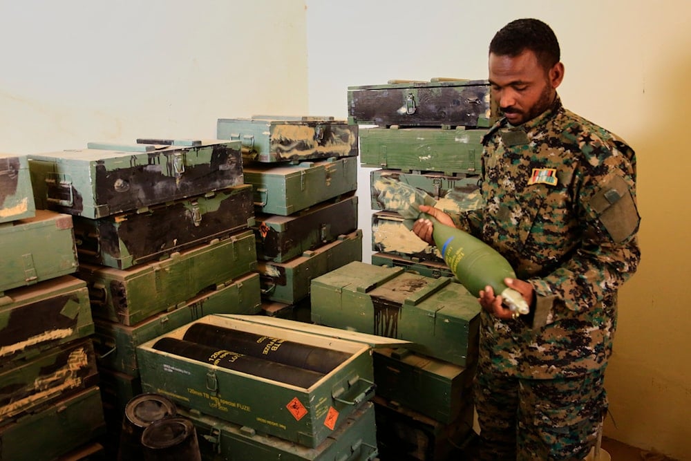 Sudanese army officers inspect a recently discovered weapons storage site belonging to the paramilitary Rapid Support Forces (RSF) in Khartoum, Sudan, on May 3, 2025. (AP Photo)