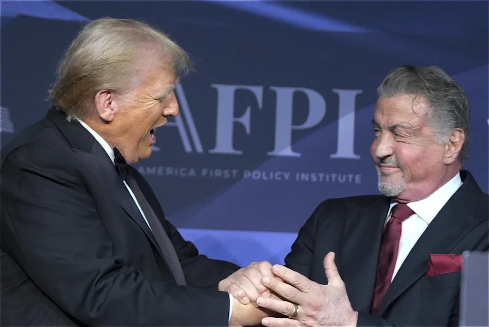 President-elect Donald Trump greets actor Sylvester Stallone during an American First Policy Institute gala at his Mar-a-Lago estate on November 14, 2024 in Palm Beach Florida (AP/Alex Brandon)