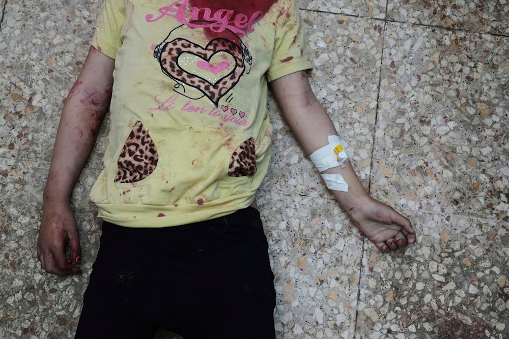 The body of Palestinian Aya Al-Talli, 5, who was killed in an Israeli army airstrike of the Gaza Strip, lies on the floor of the Al-Aqsa Hospital in Deir al-Balah, April 27, 2025. (AP Photo/Abdel Kareem Hana)