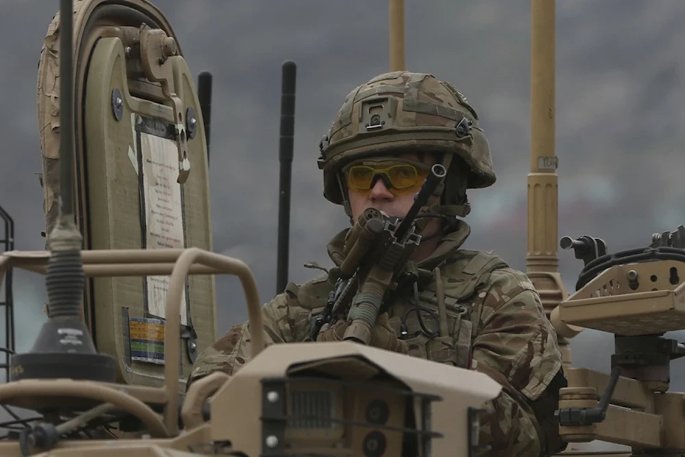 A British soldier with NATO-led Resolute Support Mission forces arrives at the site of an attack in Kabul, Afghanistan, March 25, 2020 (AP/Rahmat Gul)