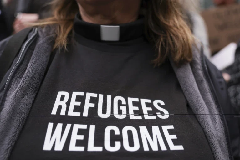 Pastor Jennifer Castle joins others outside the US District Court after a federal judge blocked President Donald Trump's effort to halt the nation's refugee admissions system, February 25, 2025, in Seattle (AP/Ryan Sun) 