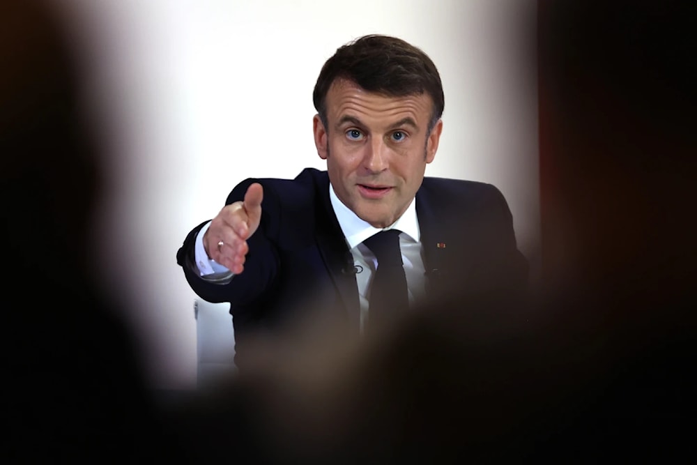 French President Emmanuel Macron gestures during his first news conference to announce his top priorities for the year, January 16, 2024, by Elysee Palace in Paris (AP/Aurelien Morissard)