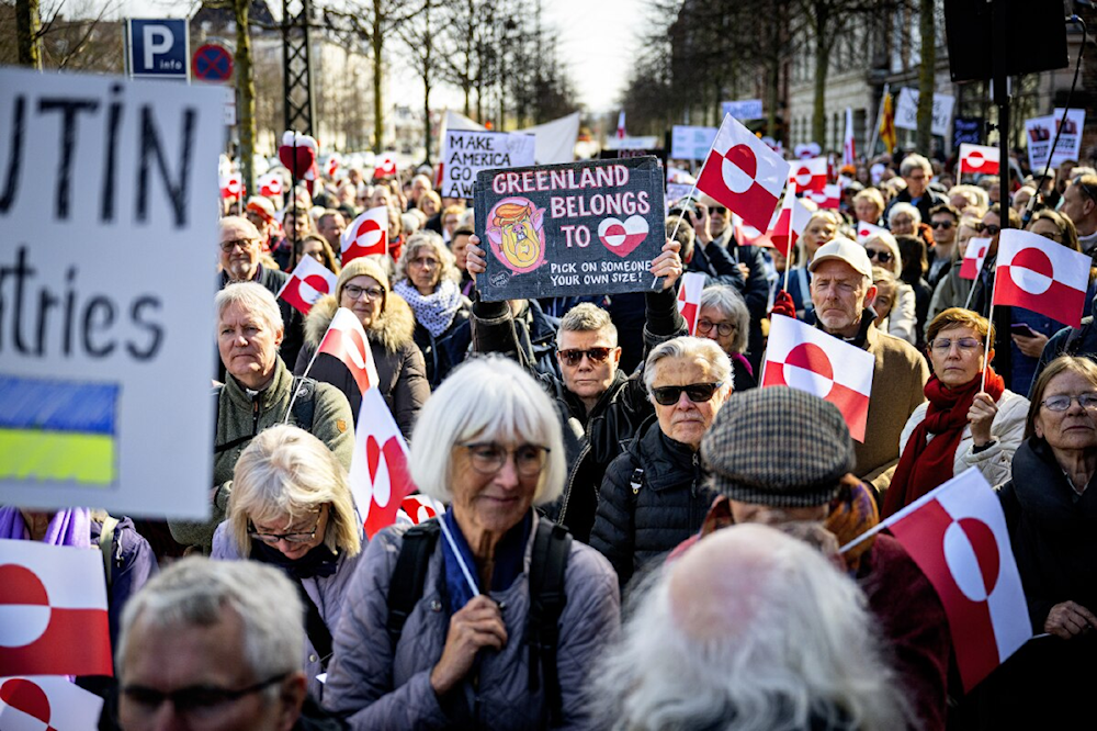Demonstrators hold Greenland flags as they protest in front of the US embassy in Copenhagen, March 29, 2025 (Nils Meilvang/Ritzau Scanpix via AP)