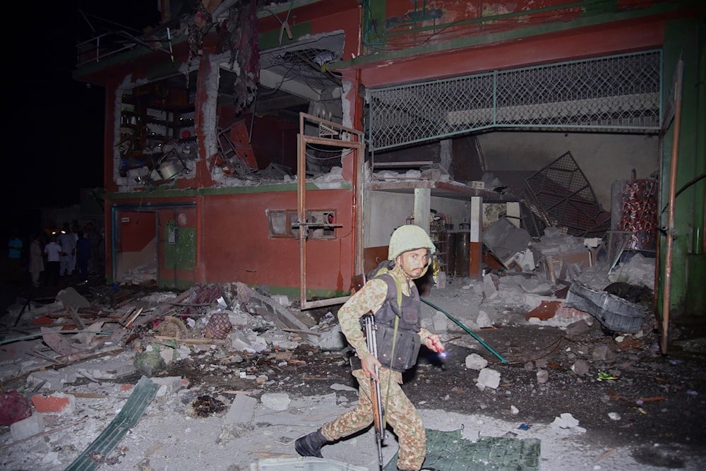 An army soldier examines a building damaged by a suspected Indian missile attack near Muzaffarabad, the capital of Pakistan controlled Kashmir, in Wednesday, May 7, 2025 (AP)
