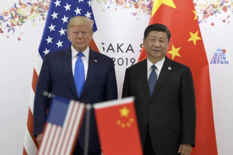 US President Donald Trump, left, poses for a photo with Chinese President Xi Jinping during a meeting on the sidelines of the G-20 summit in Osaka, Japan, June 29, 2019 (AP/Susan Walsh)