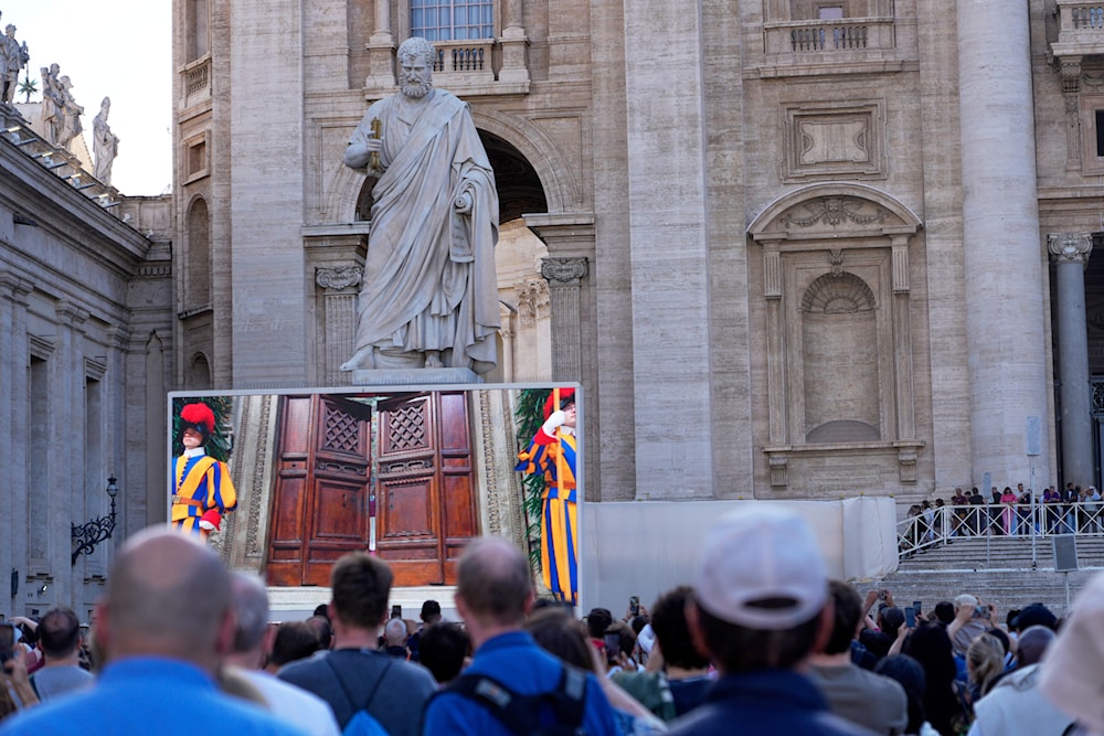 Faithful gather in St. Peter's Square as the door of the Sistine Chapel are closed to start the Conclave at the Vatican, Wednesday, May 7, 2025. (AP )