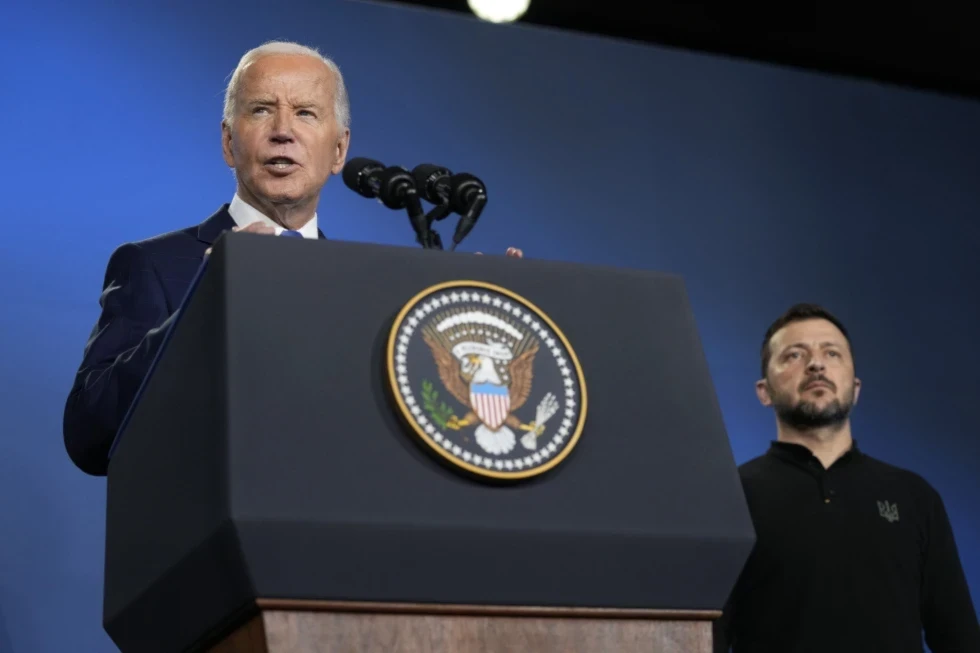 Former President Joe Biden, left, joined by President of Ukraine Volodymyr Zelenskyy, speaks during an event on the Ukraine Compact on the sidelines of the NATO Summit in Washington, July 11, 2024. (AP/Susan Walsh)