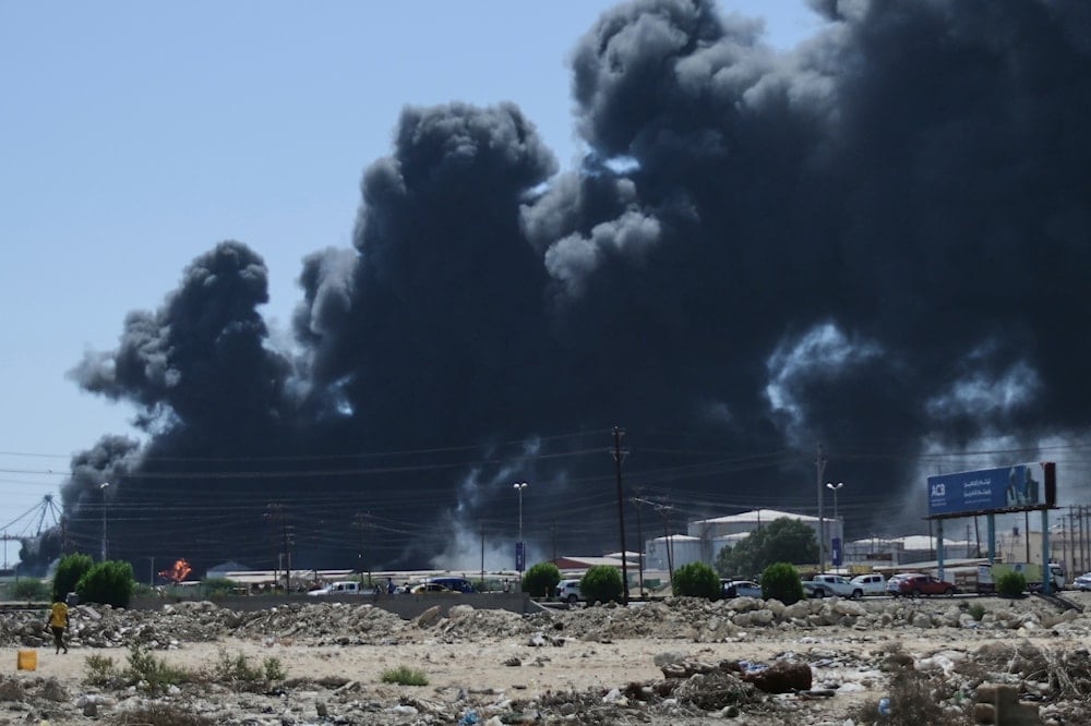Smoke billows after drone strikes by the paramilitary Rapid Support Forces (RSF) targeted the northern port in the Red Sea city of Port Sudan, Sudan, Tuesday, May 6, 2025 (AP)