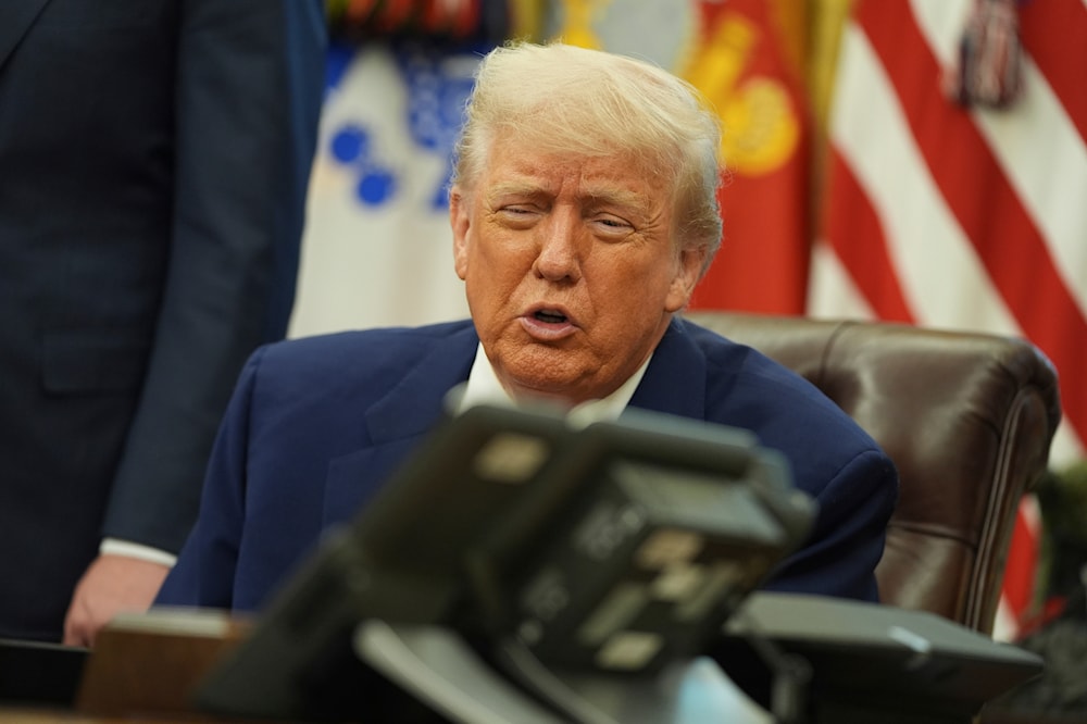 President Donald Trump speaks on the phone to Britian's Prime Minister Keir Starmer aon a trade deal between the US and United Kingdom in the Oval Office of the White House, Thursday, May 8, 2025, in Washington. (AP)