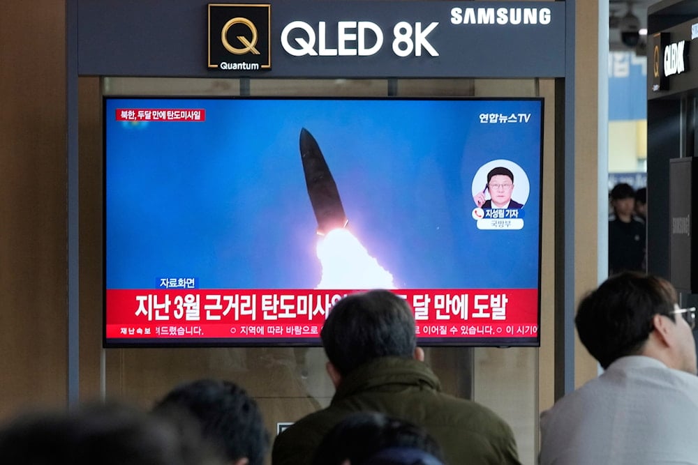 A TV screen shows a file image of the DPRK's missile launch during a news program at Seoul Railway Station in Seoul, South Korea, Thursday, May 8, 2025 (AP)