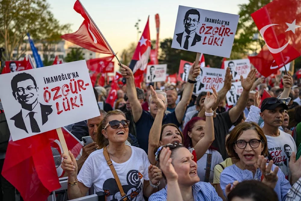 Protesters take part in a demonstration against the detention of Ekrem Imamoglu on May 7 (Yasin Akgul/AFP)