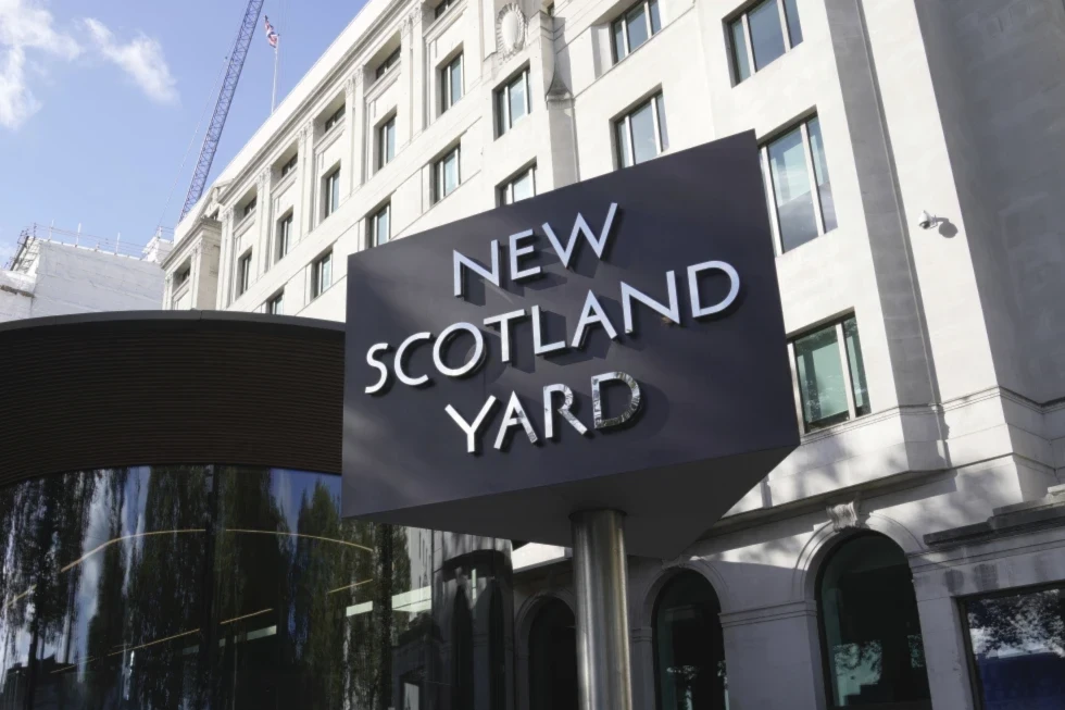 A sign stands in front of the New Scotland Yard, the headquarters of the London Metropolitan Police, in London, Sept. 25, 2023. (AP/Kin Cheung)