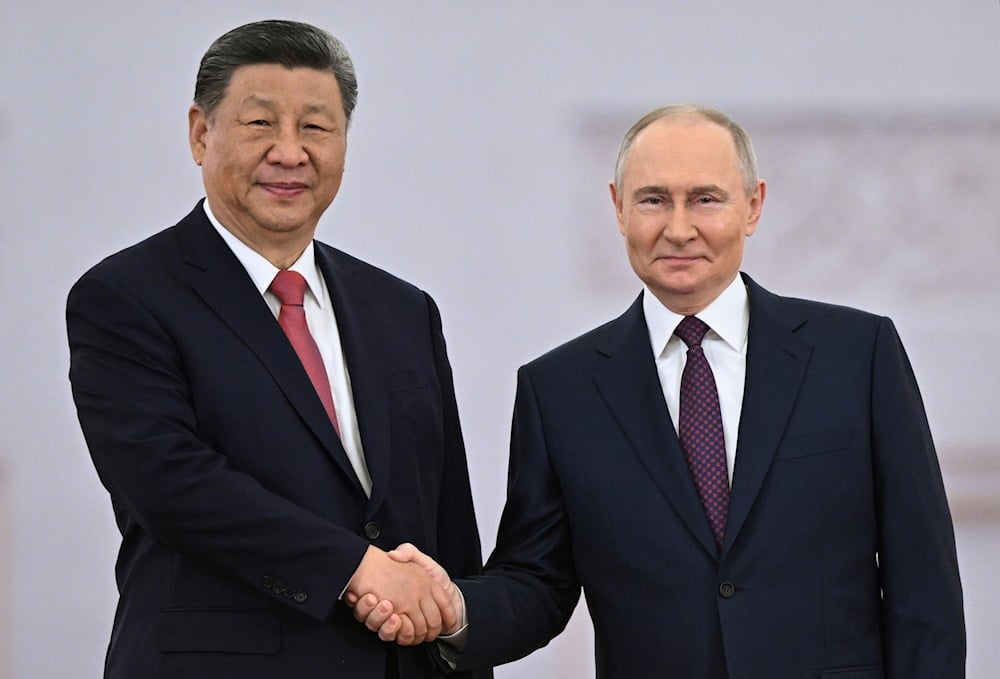 Russian President Vladimir Putin, right, and his Chinese counterpart Xi Jinping shake hands during a welcoming ceremony before their talks at the Kremlin in Moscow, Russia, Thursday, May 8, 2025 (AP)