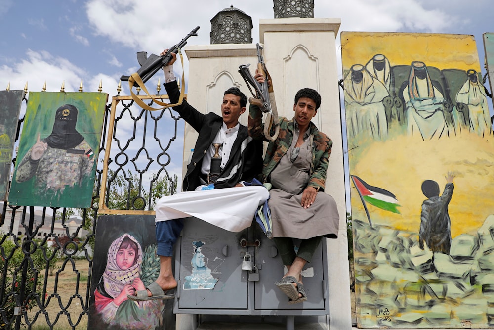 Ansar Allah supporters chant slogans in front of banners supporting Palestinians, during pro-Palestine rally in Sanaa, Yemen, Friday, April 25, 2025. (AP)