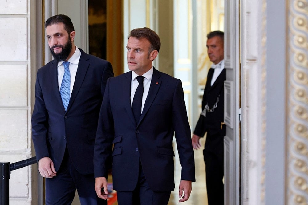 Syria's interim President Ahmad al-Sharaa, left, and French President Emmanuel Macron arrive for a joint press conference at the Elysee Palace in Paris, Wednesday, May 7, 2025 (AP)