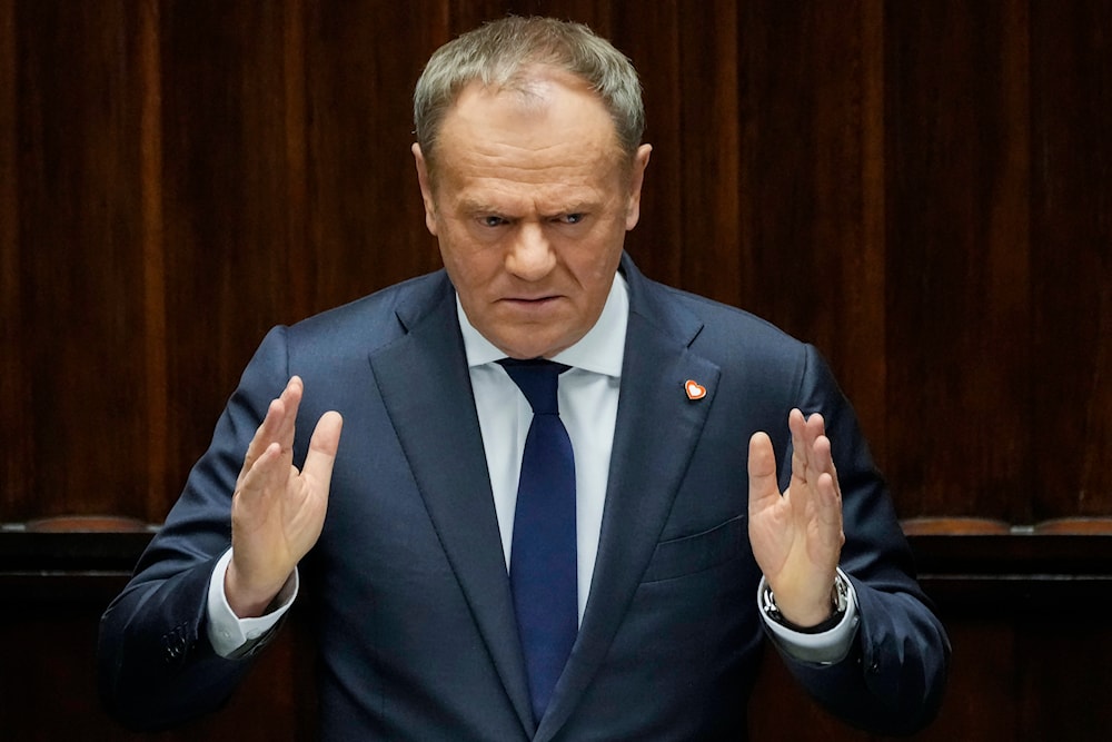 Polish Prime Minister Donald Tusk speaks at the Sejm, the lower house of parliament, in Warsaw, Poland, Friday March 7, 2025 (AP)