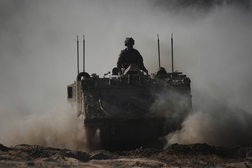 Israeli troops move with APC, armored personnel carrier near the border with Gaza, in southern Occupied Palestine, Thursday, May 8, 2025 (AP)