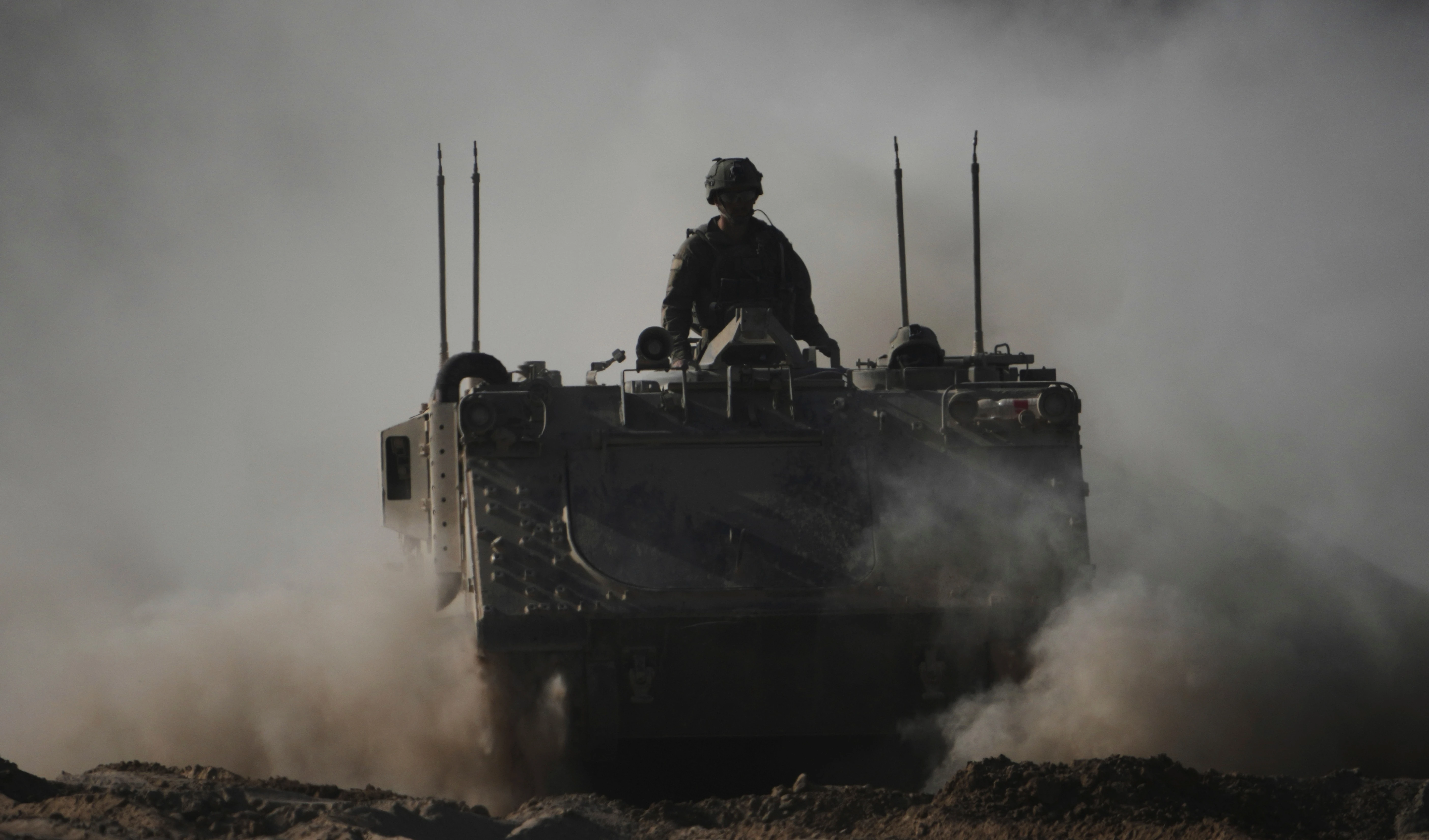 Israeli troops move with APC, armored personnel carrier near the border with Gaza, in southern Occupied Palestine, Thursday, May 8, 2025 (AP) Israeli troops move with APC, armored personnel carrier near the border with Gaza, in southern Occupied Palestine, Thursday, May 8, 2025 (AP)