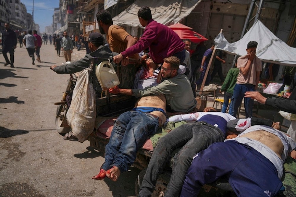 Bodies of some of the victims of an Israeli army strike on a restaurant, which killed at least 29 people, are transported from the scene to a hospital in Gaza City, May 7, 2025.(AP)