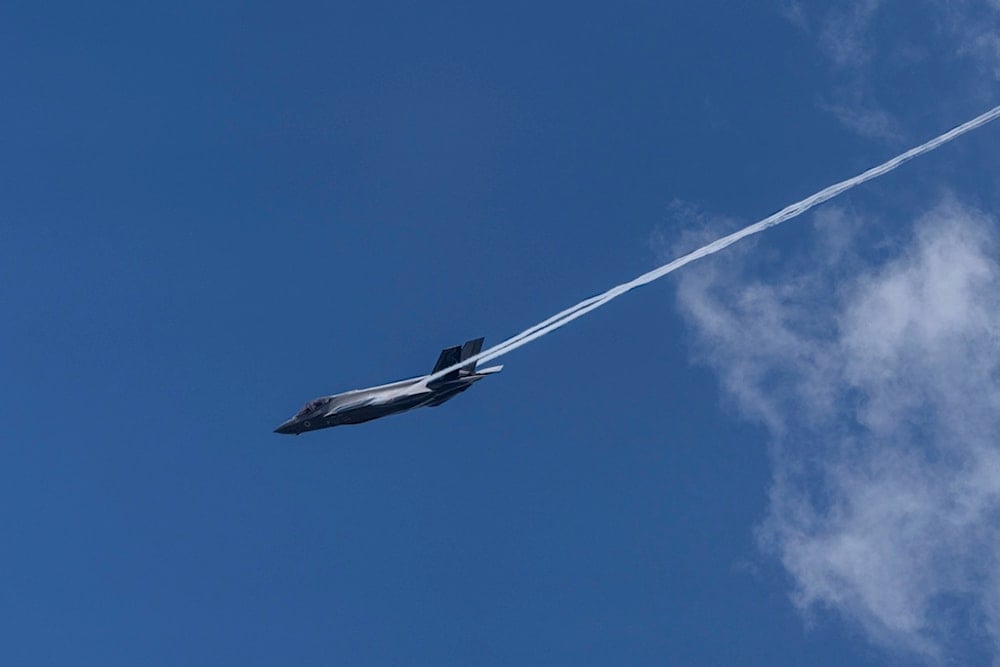 An Israeli air force F-35 war plane flies over Mount Herzl the military cemetery in occupied al-Quds, occupied Palestine, Sunday, May 12, 2024 (AP)