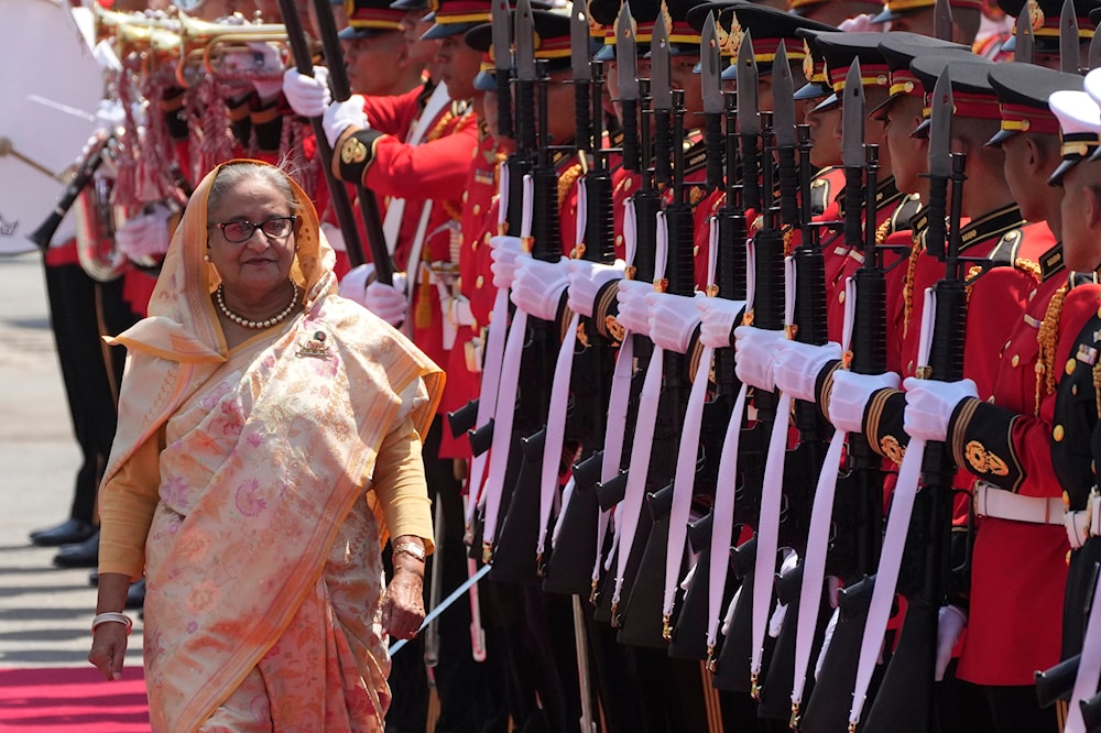  Bangladesh's Prime Minister Sheikh Hasina reviews an honor guard during a welcome ceremony at the government house in Bangkok, Thailand, Friday, April 26, 2024. (AP)