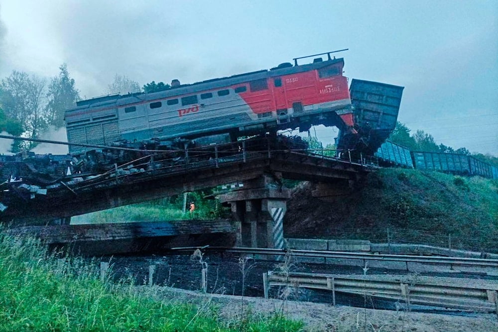 The freight train derailment in Russia's Kursk region near the Ukrainian border left a bridge severely damaged, June 1, 2025 (AP)