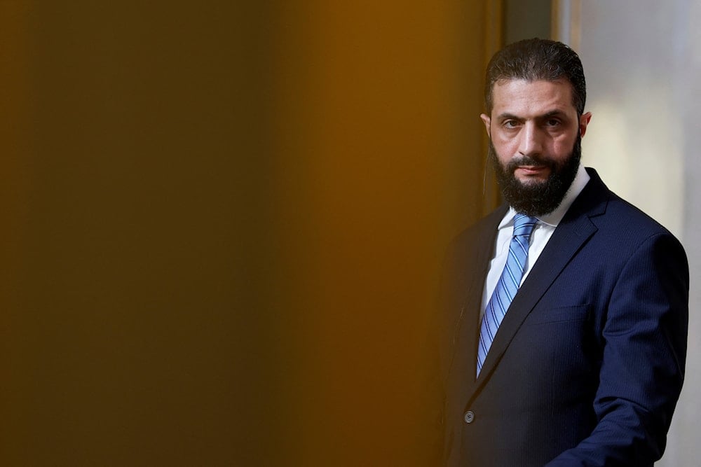 Syria's interim president, Ahmad al-Sharaa, listens during a joint press conference with French President Emmanuel Macron after a meeting at the Elysee Palace in Paris on May 7, 2025. (AP)