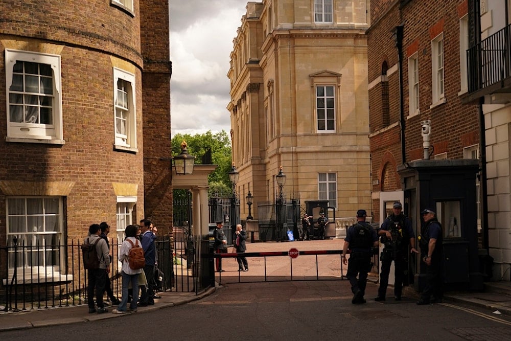 Members of the media outside Lancaster House, during the talks between the U.S. and China, in London, Tuesday, June 10, 2025. (AP Photo/Alberto Pezzali)