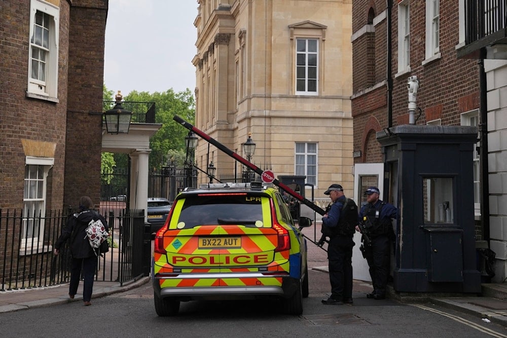 Police officers stand guard at the entrance of Lancaster House, where the trade talks between the U.S. and China are taking place, in London, Monday, June 9, 2025. (AP Photo/Kin Cheung)