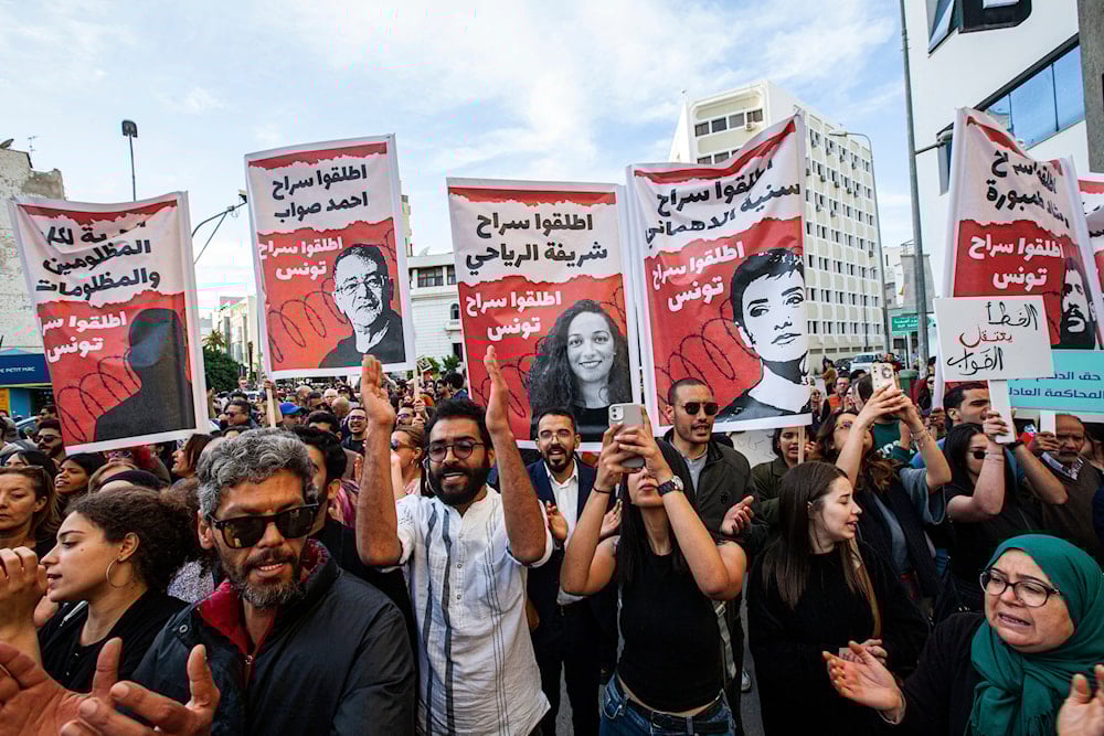 Supporters demonstrate in solidarity with Ahmed Souab, former president of the Administrative Court and a defense lawyer, who was arrested on terrorism-related charges, in Tunis, Tunisia, Friday, April 25, 2025 (AP)