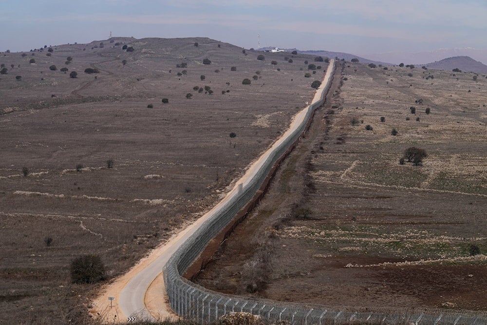 A general view of the fence on the so-called Alpha Line that separates the Israeli-annexed Golan Heights from Syria, on December 8, 2024. (AP Photo/Matias Delacroix)