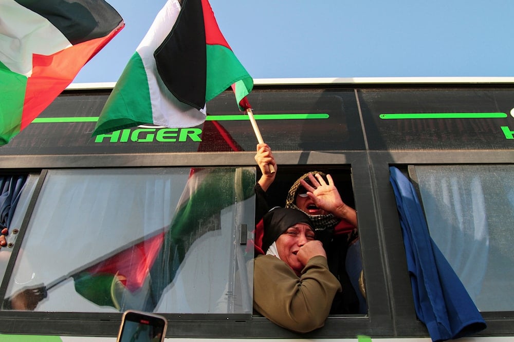 A woman reacts in a bus, part of a convoy made up of activists, from North Africa, departing from Tunisia to Gaza to break the Israeli blockade on the territory, in Gabes, Tunisia, Monday, June 9, 2025 (AP)