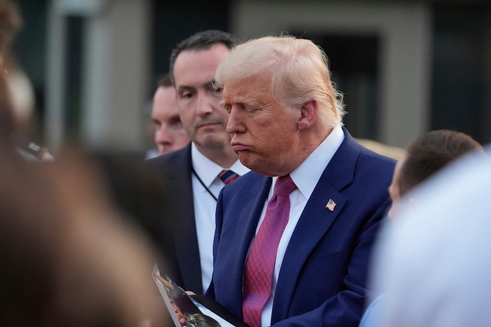 President Donald Trump greets guests during the congressional picnic on the South Lawn of the White House, Thursday, June 12, 2025, in Washington (AP)