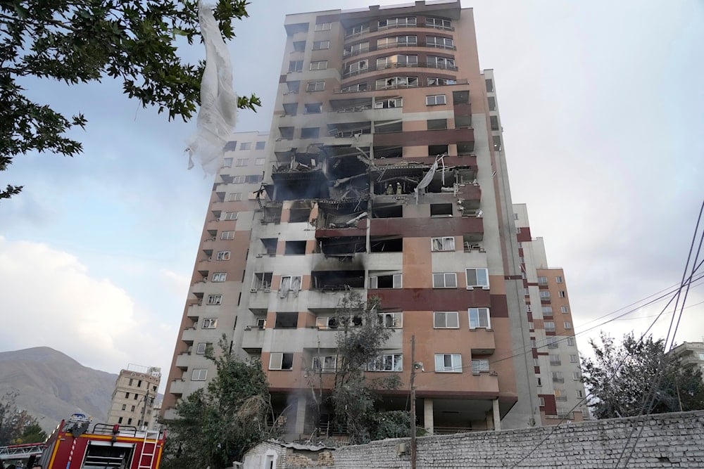 Damages are seen in a building after an explosion in a residence compound after Israel attacked Iran's capital Tehran, on June 13, 2025. (AP Photo/Vahid Salemi)