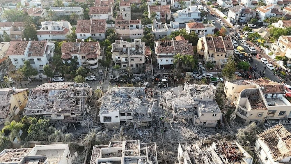 Destroyed buildings following an impact by an Iranian missiles in Rohs LeZion, Occupied Palestine, June 14, 2025 (social media)