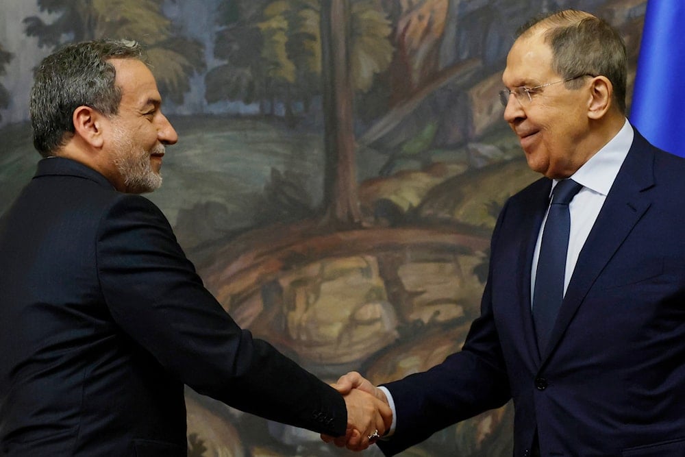 Iranian Foreign Minister Abbas Araghchi, left, and Russian Foreign Minister Sergey Lavrov shake hands after a news conference following their meeting in Moscow, Russia, Friday, April 18, 2025 (AP)
