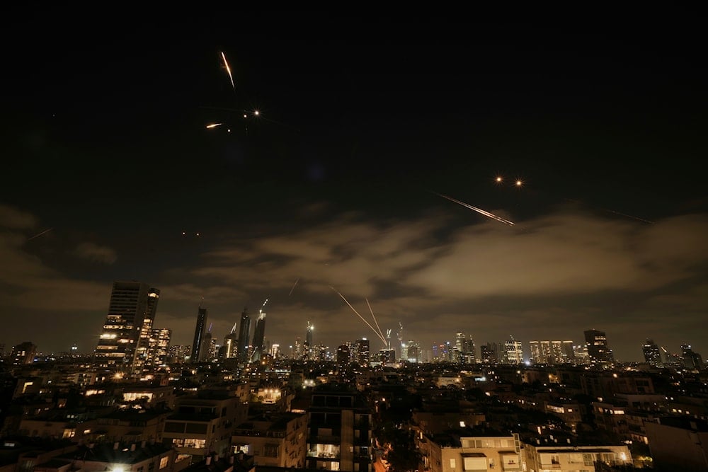 The Israeli Iron Dome air defense system fires to intercept missiles over Tel Aviv, Occupied Palestine, Sunday, June 15, 2025 (AP)