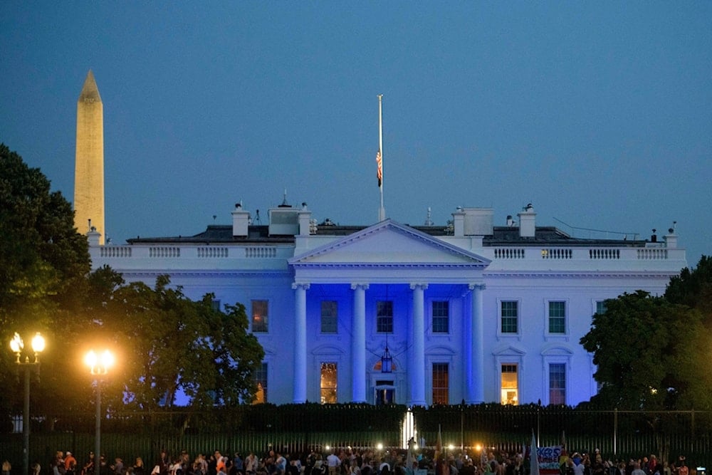The White House is seen illuminated in blue lights, in observation of National Police Week in Washington, Thursday, May 15, 2025. (AP Photo/Rod Lamkey, Jr.)