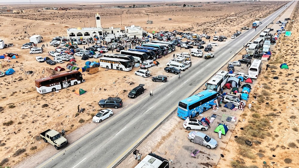 A convoy carrying hundreds of activists to the Gaza Strip to challenge the Israeli blockade on humanitarian aid on the territory stops in Sirte, eastern Libya, Sunday, June 15, 2025 (AP)