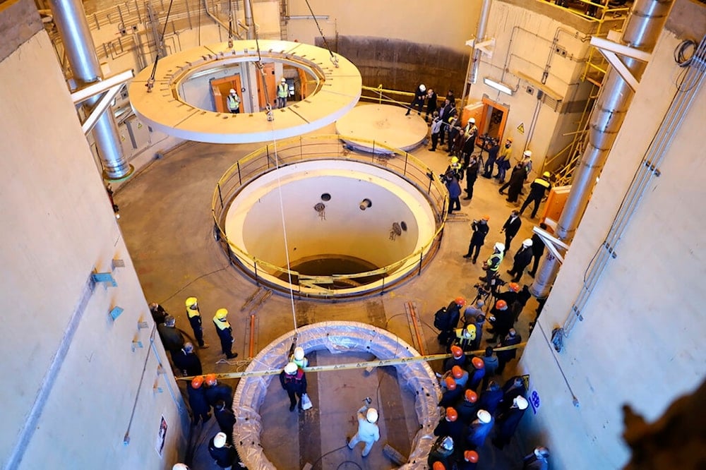 In this Dec. 23, 2019 file photo released by the Atomic Energy Organization of Iran, technicians work at the Arak heavy water reactor's secondary circuit near Arak, Iran (AEOI)