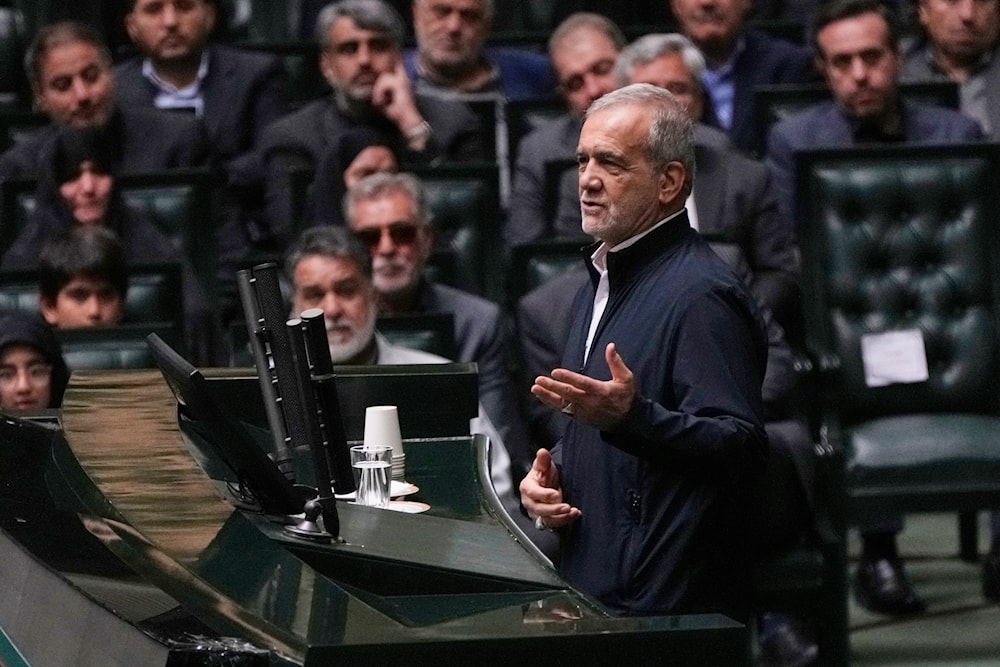 Iranian President Masoud Pezeshkian speaks during a memorial at the parliament in Tehran, Iran, Wednesday, May 21, 2025. (AP)