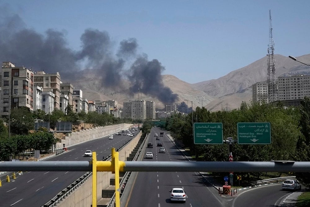Smoke rises from an oil storage facility after it appeared to have been struck by an Israeli strike on Saturday, in Tehran, Iran, Monday, June 16, 2025 (AP)